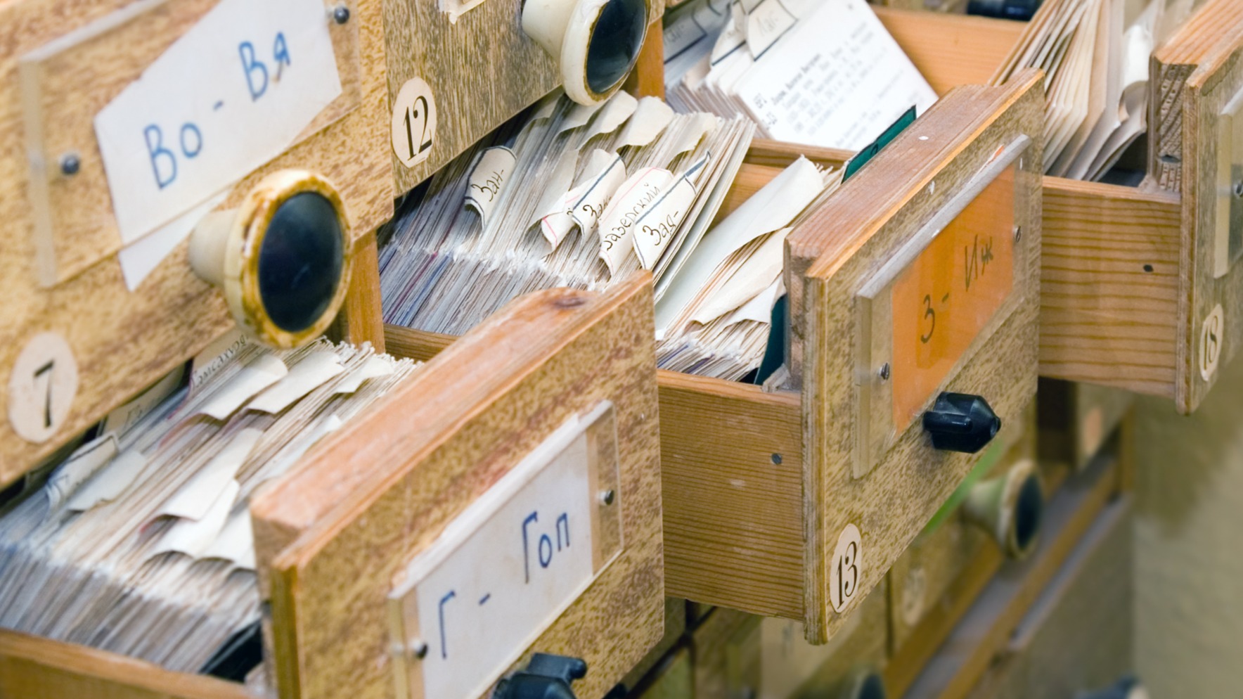 An messy index card drawer in a library